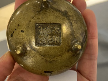 Three Chinese bronze censers and a silver-inlaid bronze vase, Qing