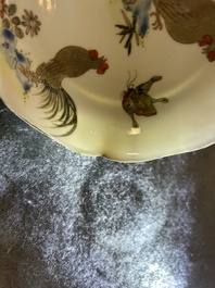 A Chinese grisaille and gilt 'roosters' cup and two saucers, Yongzheng