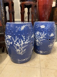 A pair of Chinese white slip-decorated blue-ground garden seats, 19th C.