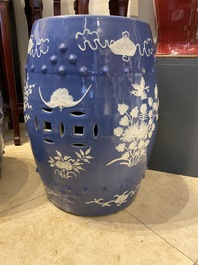 A pair of Chinese white slip-decorated blue-ground garden seats, 19th C.