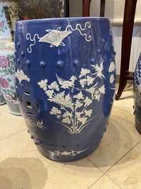 A pair of Chinese white slip-decorated blue-ground garden seats, 19th C.