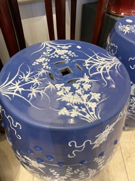 A pair of Chinese white slip-decorated blue-ground garden seats, 19th C.
