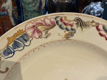 A Chinese famille rose armorial dish for the Dutch market with the arms of 'Tulleken', Qianlong