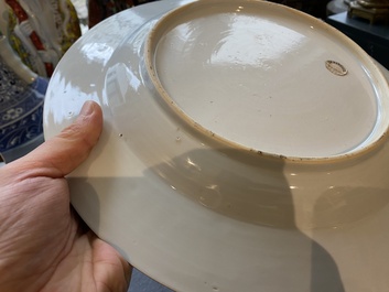 A Chinese famille rose armorial dish for the Dutch market with the arms of 'Tulleken', Qianlong