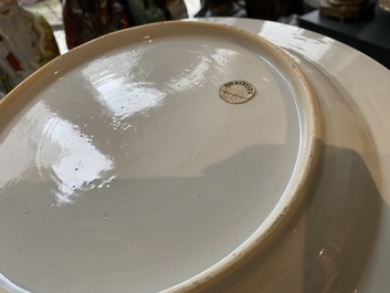 A Chinese famille rose armorial dish for the Dutch market with the arms of 'Tulleken', Qianlong