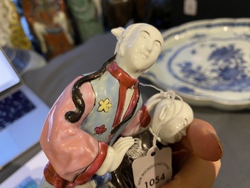 A Chinese famille rose 'ear cleaning' group, Qianlong