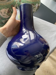 A Chinese monochrome 'sacrificial blue' bottle vase, 18/19th C.