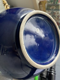 A Chinese monochrome 'sacrificial blue' bottle vase, 18/19th C.