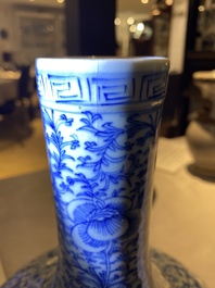 Three Chinese blue and white, crackle-glazed and powder-blue vases, 19th C.