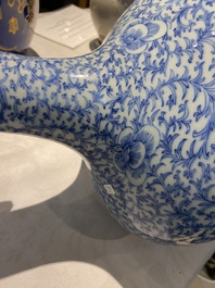 Three Chinese blue and white, crackle-glazed and powder-blue vases, 19th C.