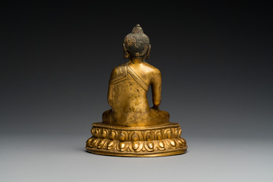 A Sino-Tibetan gilt bronze Buddha, 18th C.