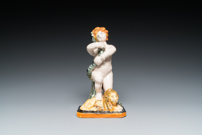 Sculpture d'un putto au serpent reposant sur un lion en fa&iuml;ence polychrome de Bruxelles, fin du 18&egrave;me