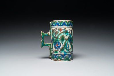 A polychrome Iznik-style mug, Kutahya, Turkey, 19th C.