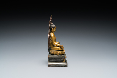 A Sino-Tibetan gilt and silvered copper alloy Medicine Buddha or Bhaishajyaguru, 19th C.