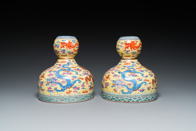 A pair of Chinese famille rose yellow-ground 'dragon' vases, Qianlong mark, 20th C.