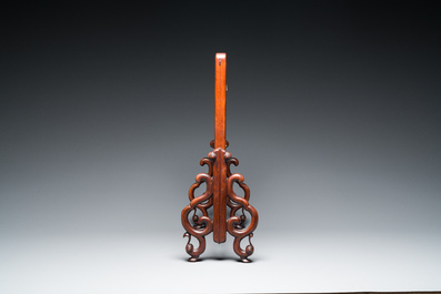 A Chinese famille verte plaque set in a partly huanghuali wooden table screen, Kangxi