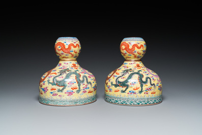 A pair of Chinese famille rose yellow-ground 'dragon' vases, Qianlong mark, 20th C.