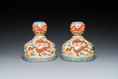 A pair of Chinese famille rose yellow-ground 'dragon' vases, Qianlong mark, 20th C.