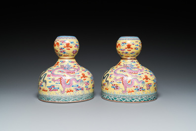 A pair of Chinese famille rose yellow-ground 'dragon' vases, Qianlong mark, 20th C.