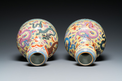 A pair of Chinese famille rose yellow-ground 'dragon' vases, Qianlong mark, 20th C.