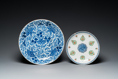 A Chinese blue and white 'peony scroll' dish and a famille verte dish, Kangxi