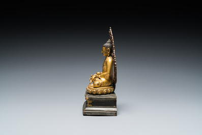 A Sino-Tibetan gilt and silvered copper alloy Medicine Buddha or Bhaishajyaguru, 19th C.