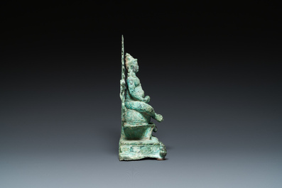 A bronze group with Kubera on a throne, Central Java, Indonesia, 11/12th C.