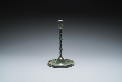 A Dutch or Flemish knotted bronze candlestick, 15th C.