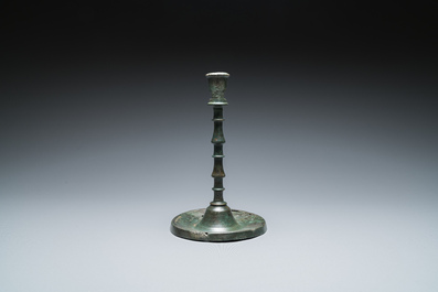 A Dutch or Flemish knotted bronze candlestick, 15th C.