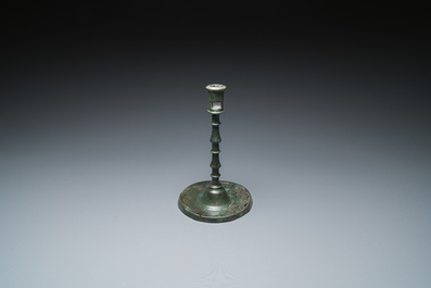 A Dutch or Flemish knotted bronze candlestick, 15th C.