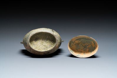 A Chinese bronze 'you' ritual wine ewer, Zhou, ca. 11th-9th C. b.C.