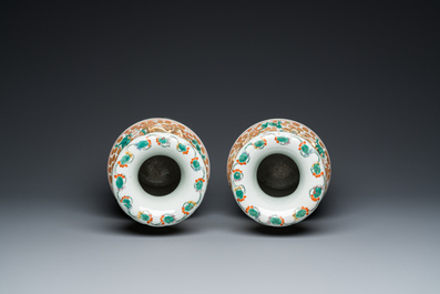 A pair of Chinese Canton famille rose 'immortals' vases, 19th C.
