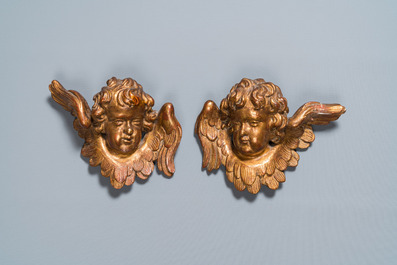 A pair of gilded wooden winged cherub heads, probably Italy, 18th C.