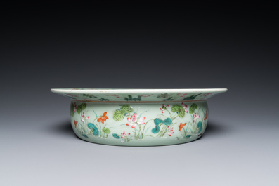 A Chinese famille rose celadon-ground 'carps' basin, 19th C.