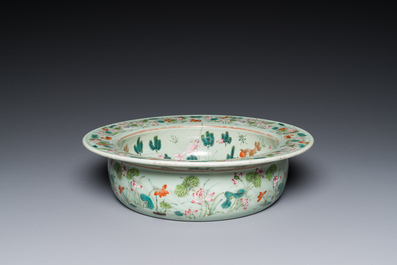 A Chinese famille rose celadon-ground 'carps' basin, 19th C.