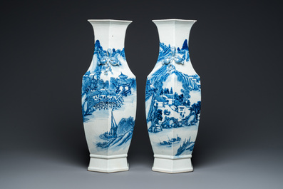 A pair of Chinese blue and white hexagonal 'mountainous landscape' vases, 19th C.