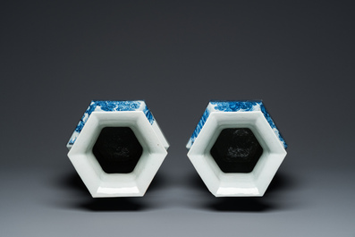 A pair of Chinese blue and white hexagonal 'mountainous landscape' vases, 19th C.
