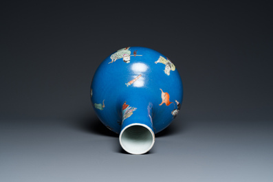 A Chinese blue-ground famille rose 'eight immortals' bottle vase, Qianlong mark, 19th C.