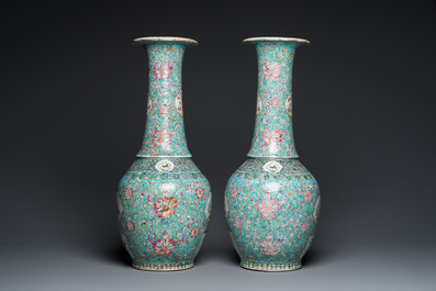 A pair of Chinese turquoise-ground famille rose vases, 19th C.