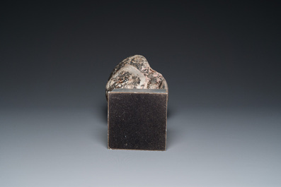 A Khmer stone head with traces of polychromy, Cambodia or Thailand, 13/16th C.