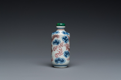 A Chinese blue, white and copper-red 'dragon' snuff bottle, Yongzheng mark, 19th C.