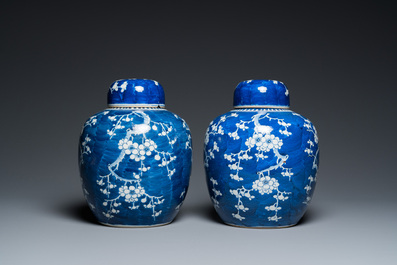 A pair of Chinese blue and white jars and covers, 19th C.