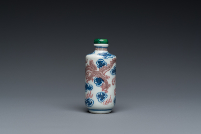 A Chinese blue, white and copper-red 'dragon' snuff bottle, Yongzheng mark, 19th C.
