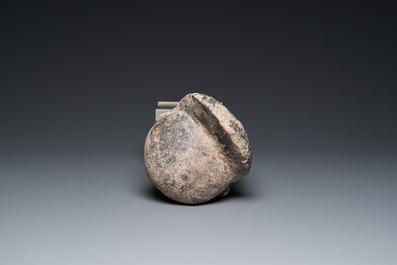 A Khmer stone head with traces of polychromy, Cambodia or Thailand, 13/16th C.