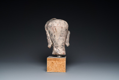 A Khmer stone head with traces of polychromy, Cambodia or Thailand, 13/16th C.