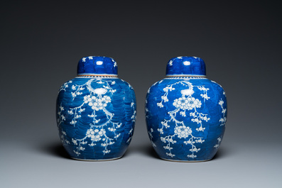 A pair of Chinese blue and white jars and covers, 19th C.