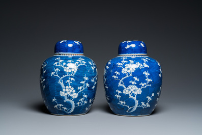A pair of Chinese blue and white jars and covers, 19th C.