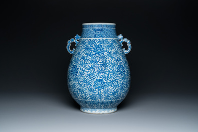 A Chinese blue and white 'hu' vase with lotus scrolls, Qianlong mark, 19th C.
