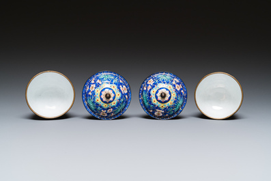 A pair of Chinese blue-ground Canton enamel covered bowls on stands, Qianlong