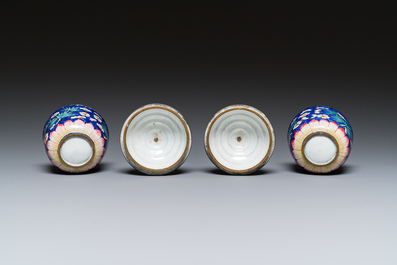 A pair of Chinese blue-ground Canton enamel covered bowls on stands, Qianlong